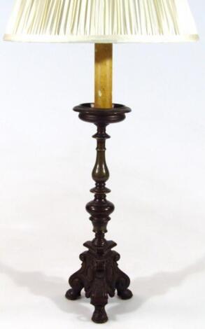 A 20thC bronze candle stand