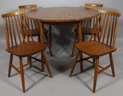 A retro melamine style walnut finish dining room suite