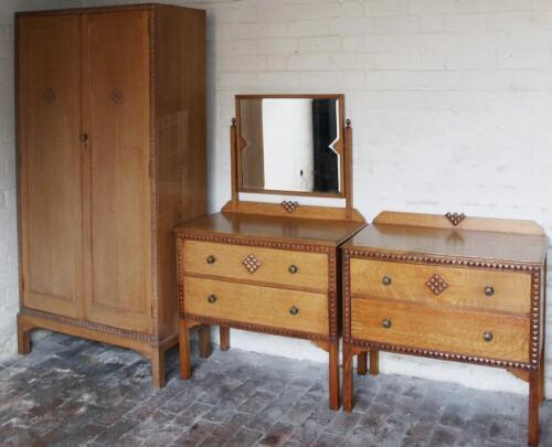 An early to mid-20thC Waring & Gillow three piece light oak bedroom suite