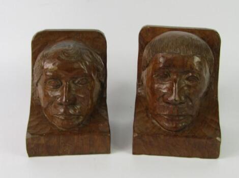 A pair of Thomas 'Gnomeman' Whittaker wooden book ends carved with figural heads