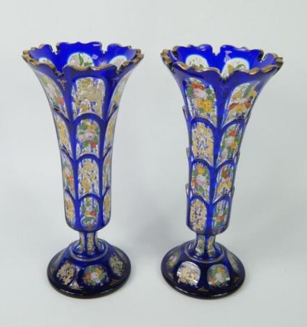 A pair of Bohemian late 19thC blue flashed glass vases