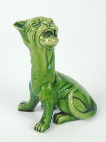 An Aller Vale late 19thC green glazed pottery figure of a seated grotesque cat