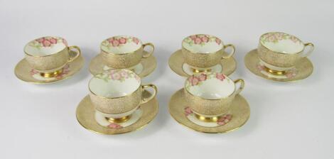 A set of six Paragon porcelain coffee cups and saucers