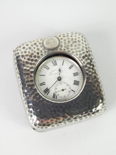 An Edward VII silver strut pocket watch case with hammered decoration