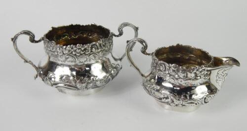 A George IV silver cream jug and sugar bowl