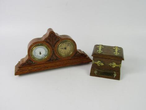 An early 20thC oak mantel clock and barometer