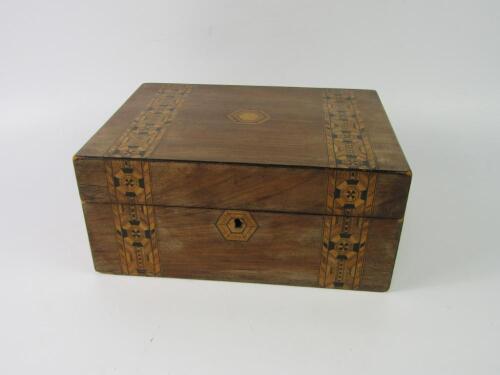 A Victorian walnut and inlaid sewing box