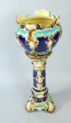 A late 19thC majolica jardiniere on stand