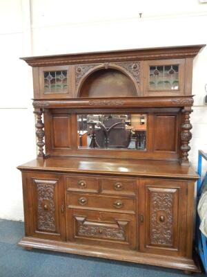 A Victorian carved oak mirror back sideboard