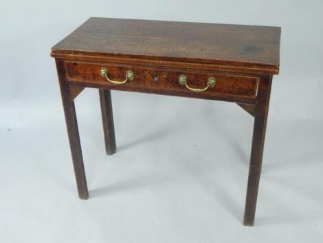 A George III oak fold over tea table