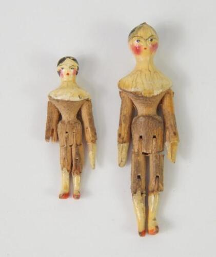 Two early 19thC miniature painted wooden jointed dolls