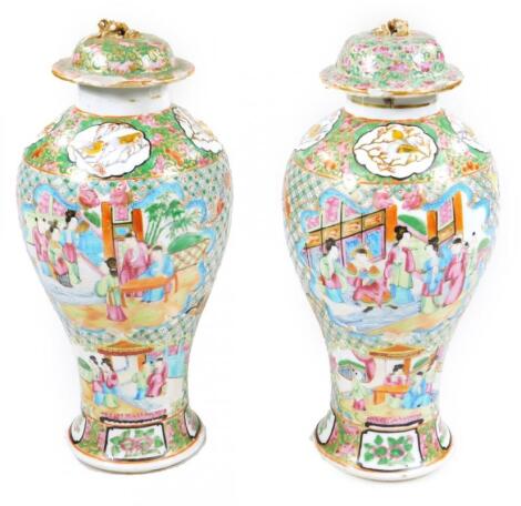A pair of 19thC Chinese baluster vases and covers