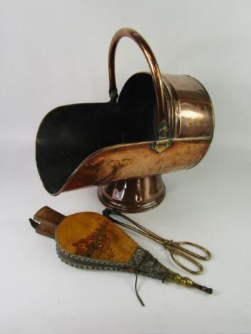 A copper and brass coal scuttle