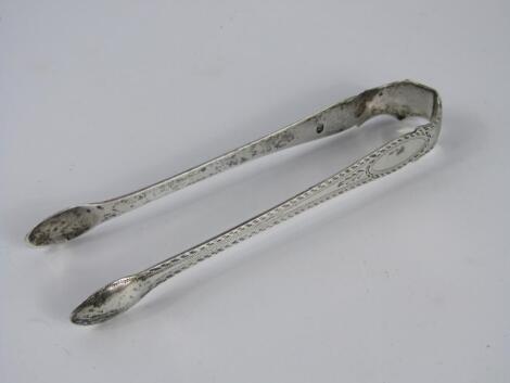 A pair of Georgian silver sugar tongs