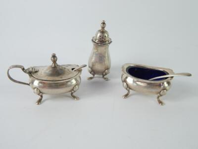 A silver three piece condiment set