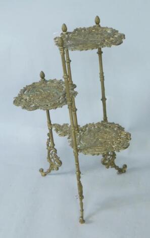 A brass three tier jardiniere stand