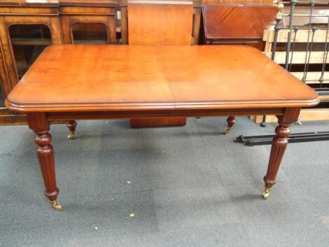 A Victorian style mahogany extending dining table