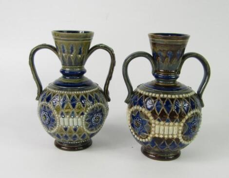 A pair of Doulton Lambeth late 19thC stoneware vases