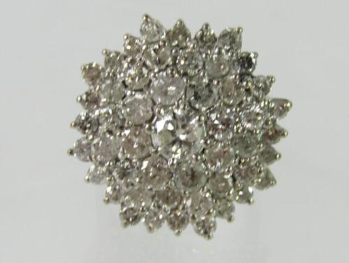 An 18ct white gold and diamond cluster ring