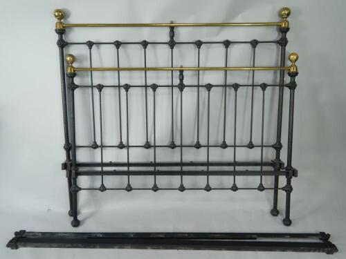 A Victorian style brass and cast iron double bed.