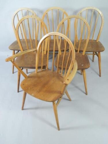 A set of six Ercol ash and elm spindle back kitchen chairs