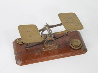 A set of brass postal scales