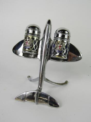 A mid 20thC chrome novelty cruet set modelled as a jet plane