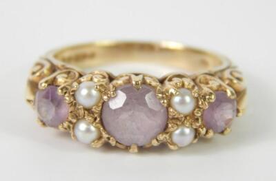 A 9ct gold and amethyst three stone ring