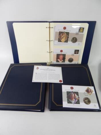 Three albums of Queen Elizabeth II Diamond Jubilee commemorative coin covers.