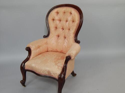 A Victorian mahogany balloon back armchair