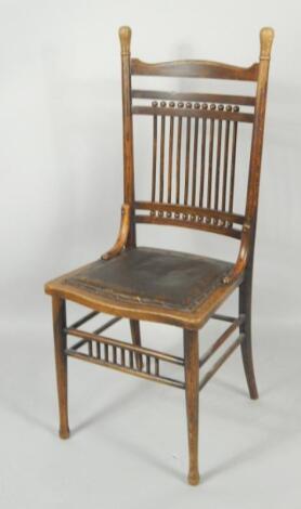 A Victorian Arts & Crafts oak spindle back chair.