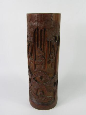 A Chinese bamboo brush pot carved with figures and trees