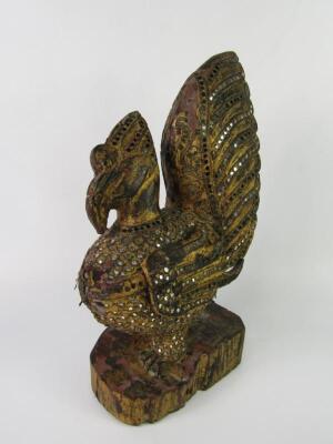 An Eastern giltwood figure of a peacock