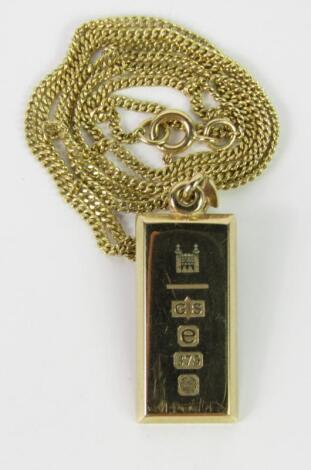 A 9ct gold ingot on chain