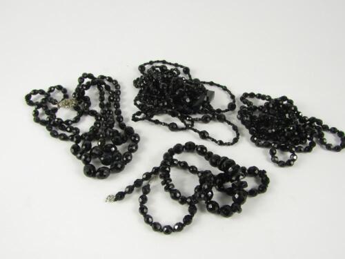 Five jet bead necklaces.