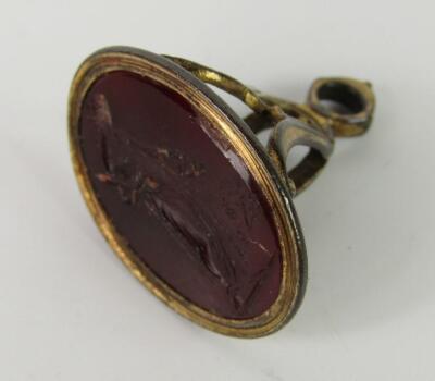 A Regency Cornelian set oval seal intaglio carved with a classical lady
