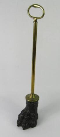 A Victorian brass and cast iron door stop