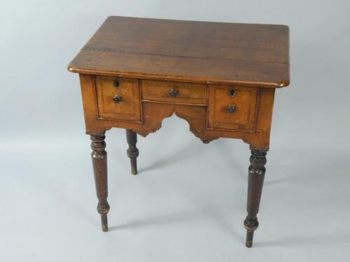 An oak and walnut lowboy