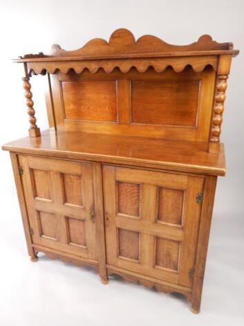 An Arts & Crafts style oak chiffonier