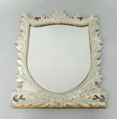 A grey painted wooden shield shaped wall mirror