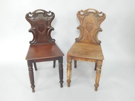 A pair of Victorian mahogany hall chairs