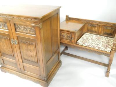 An Old Charm oak cabinet with linenfold panelled doors