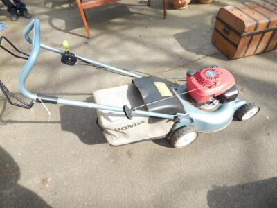 A Honda ISY Easystart petrol lawn mower.