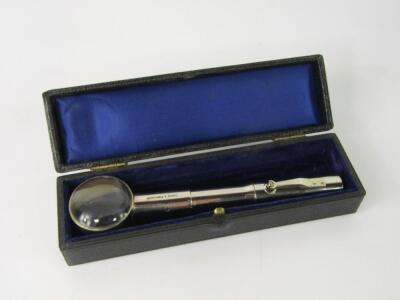A Curry & Paxton magnifying glass with battery operated torch