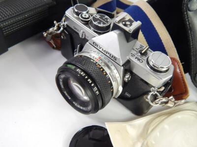 An Olympus OM-2 camera - 2