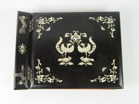 A Chinese lacquer and mother of pearl inlaid bound photograph album