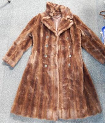 An Astrakan full length faux fur coat