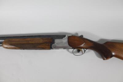 A Miroku 12 bore under and over double barrel shotgun