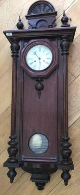 A walnut and mahogany cased wall clock