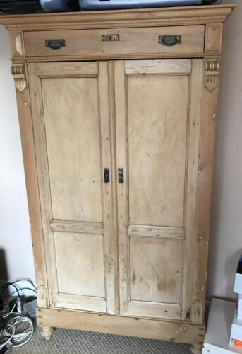 A 19thC stripped pine continental armoire.